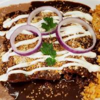Emoladas (Enchiladas With Mole Sauce) · Three corn tortillas with your choice of filling and topped with mole sauce, cheese, and sou...