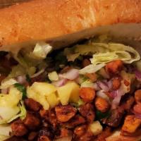 Tortas · Comes with refried beans, mayonnaise, lettuce, pico de gallo, guacamole, red onion and your ...