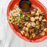 Appetizer Mojo De Ajo · 1/2 LB of shrimp  sautéed with mushrooms and onions in slightly spicy garlic butter.