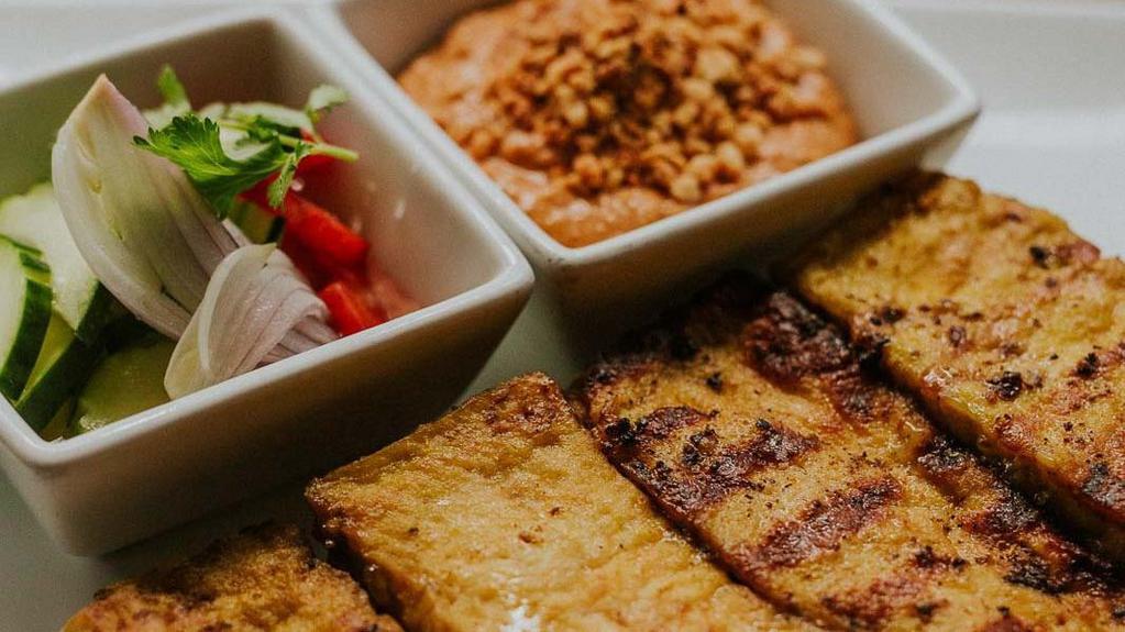 Kati Satay · Grilled marinated tofu cubes on skewers, served with Kati’s own hand-roasted peanut sauce. (GF)