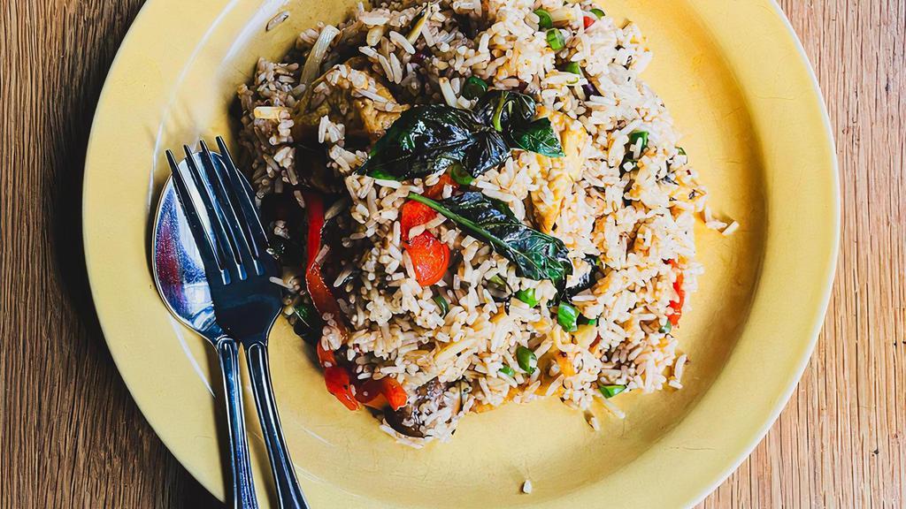 Hot Basil Fried Rice · Fried rice stir-fried with hot basil, crimini mushrooms, bell peppers, fried tofu, diced string beans & slivers of bamboo shoot.