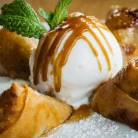 Coconut Fancy · Crispy rolls of banana and coconut filling. Served with coconut ice cream and homemade Kati ...