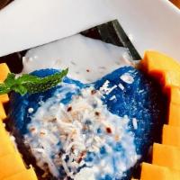 Mango With Sweet Sticky Rice · Slices of ripe mango served with sweet sticky rice steamed with blue butterfly pea flower & ...