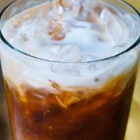 Thai Iced Tea · A lightly sweetened spiced tea with a dollop of coconut milk.