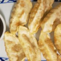 Pot Sticker · Crispy pot stickers, stuffed with chicken and vegetables served with special soy sauce.
