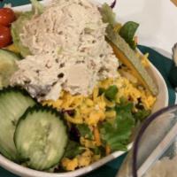 Alligator Pear · Sliced avocado topped with chicken salad(CONTAINS NUTS) on a bed of mixed greens with other ...