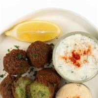 Falafel Plate Combo · Fried Falafel Balls Served w/ Basmati Rice, Side Salad, Fresh Pita & Your Choice of Sauce. C...