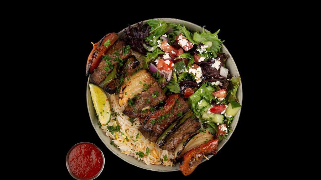 Beef Kabob Plate · Chargrilled Cubes of Beef Served w/ Basmati Rice, Side Salad, Fresh Pita & Your Choice of Sauce.