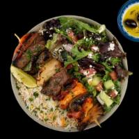 Combo Kabob Plate · Your Choice of 2 Flavorful Kabobs Served w/ Basmati Rice, Side Salad, Fresh Pita & Your Choi...