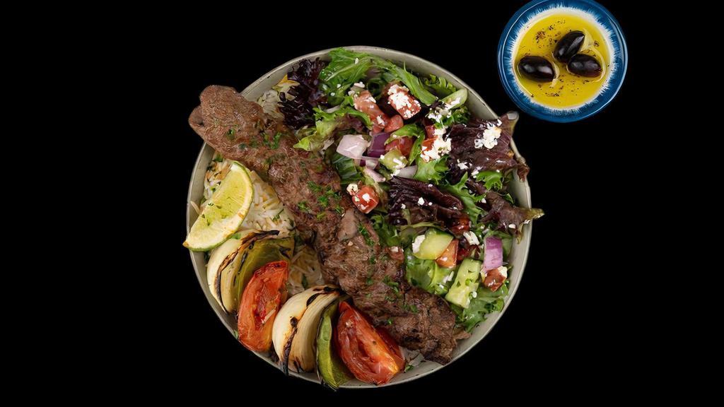 Beef Koobideh Kabob Plate · Ground Seasoned Beef Kabobs Served w/ Basmati Rice, Side Salad, Fresh Pita & Your Choice of Sauce.