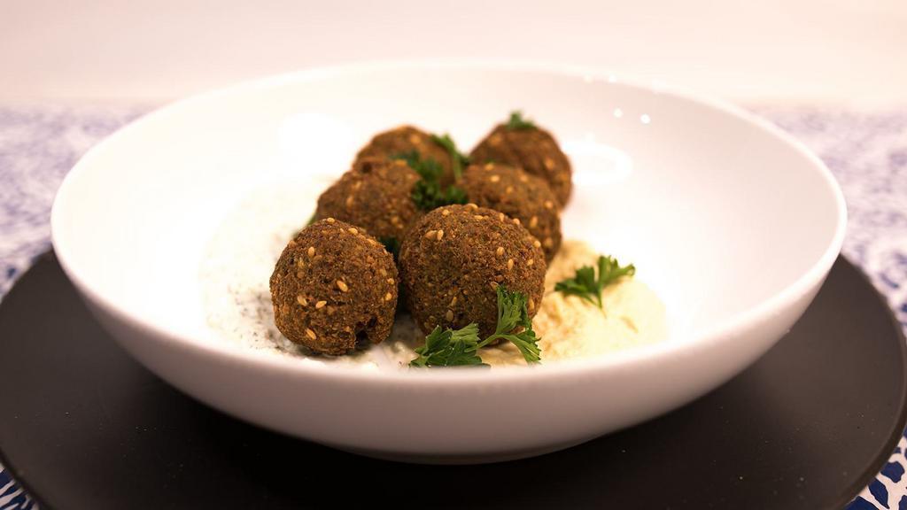 4 Falafel · Traditional Deep Fried Falafel. Made From Ground Chickpeas, Herbs, & Spices.