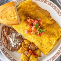 Omelet Taste Of Mexico · Carne Asada, onions, peppers, tomatoes and cheese blend. Served with refried beans and house...