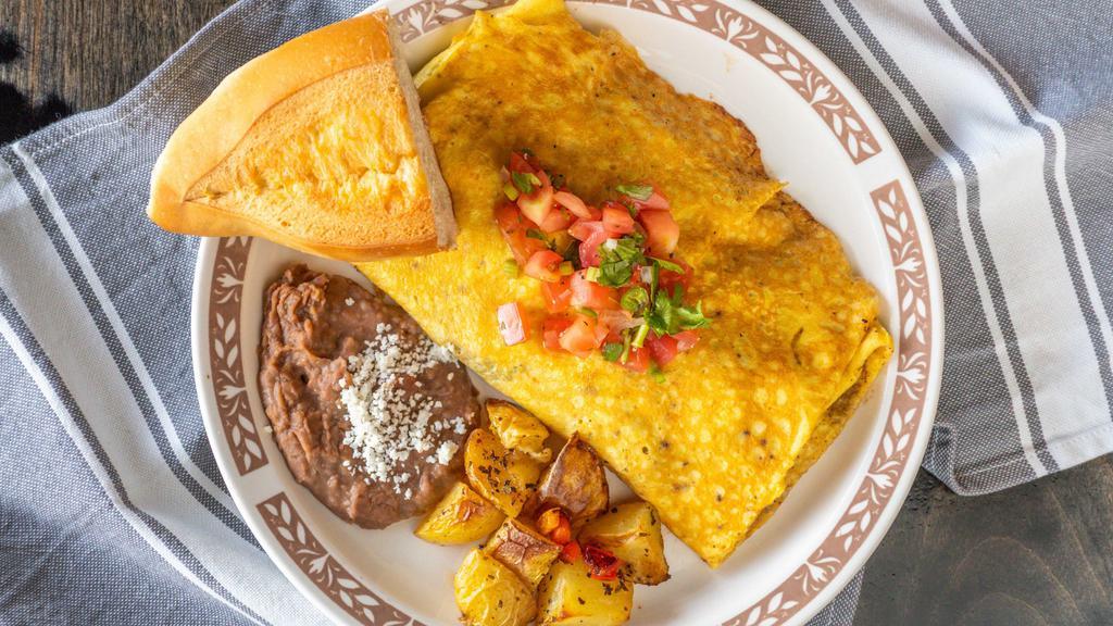 Omelet Taste Of Mexico · Carne Asada, onions, peppers, tomatoes and cheese blend. Served with refried beans and house potatoes and Pico de Gallo. Your choice of tortilla, toast or bolillo (white bread roll).