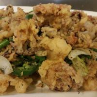 Pepper Salted Squid · Crispy sauid deep fried tossed with jalapenos and onions lightly seasoned.