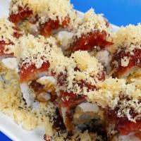 Nevada Queen · Inside: shrimp tempura, cream cheese 
Outside: spicy tuna, eel sauce, crunch