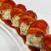 Tiger Roll · Inside: shrimp tempura, cucumber
Outside: spicy tuna, eel sauce
