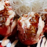 Salmon Tomato · Inside: yum yum crab, avocado
Outside: yum yum crab, eel sauce, spicy mayo