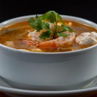 Tom Yum Soup 🌶️ · The most famous Thai spicy and sour soup with lemongrass broth. Choice - chicken, pork, tofu...