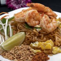 Pad Thai · Stir-fried rice noodle with egg, bean sprouts, scallions, carrot, lime, and crushed peanuts....