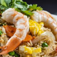 Thai Fried Rice · Stir-fried rice with egg, carrot, green pea, onion, tomato, broccoli, cucumber, and cilantro...