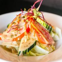 Small Salad · Lettuces, cucumbers, tomatoes, carrots, and homemade sesame dressing.