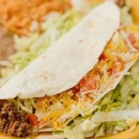 Large Soft Shelled Taco · A huge soft shell taco filled with your choice of beef, chicken or chile verde. Served with ...