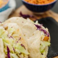 Baja Fish Tacos · Marinated filets grilled and served in a
fried flour tortilla with cabbage, lettuce
and our ...
