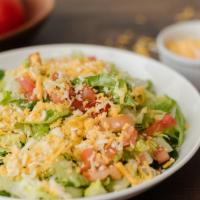 House Salad · Chilled lettuce, tomatoes and shredded cheese
served with your choice of dressing.