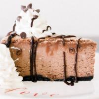 Triple Chocolate Slice · A slice of our fluffy chocolate cheesecake with mini chocolate chips and a drizzle of Ghirar...