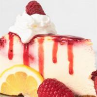 Lemon Raspberry Cheesecake · A swirl of raspberry cheesecake in a zesty lemon cheesecake, topped with fresh raspberries a...