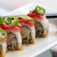 Jalapeño Roll · Spicy tempura battered jalapeño filled roll with cream cheese. Served with soy sauce, ginger...