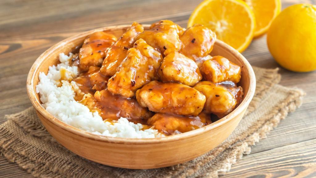 Orange Chicken Bowl · Delicious and saucy boneless chicken marinated with ginger, red chili flakes, orange zest and various house seasonings topped on fresh boiled white rice.