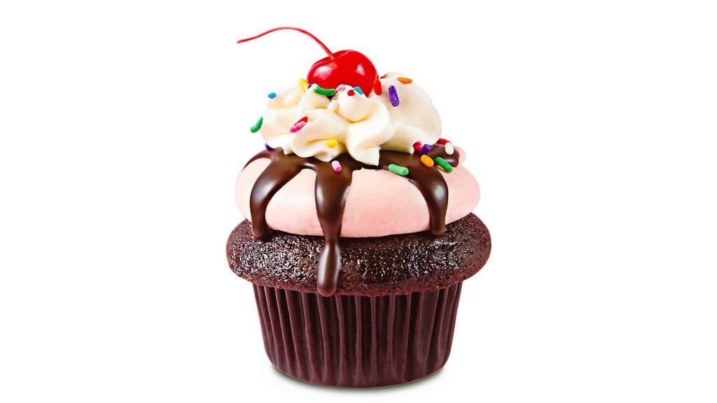 Strawberry Sundae · Chocolate, strawberry, vanilla, sprinkles and a cherry...all in one delicious party-of-a-cupcake! We start with Valrhona chocolate cake, top it with Strawberry buttercream, drizzle it with Belgian chocolate ganache and top it all off with vanilla buttercream, rainbow sprinkles and a cherry! Now that's a sundae!