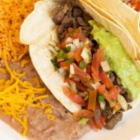 #8. Two Soft Tacos · Choice of  Carne Asada, Carnitas, Al Pastor or Fish.