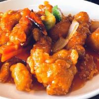 General Tso Chicken · Hot & spicy.  Lightly battered chicken, wok toss in tangy spicy sauce with carrot, onion and...