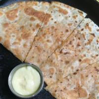 Kidsadilla · Cheese quesadilla w/cheese sauce for dipping. **Allergens: wheat, cow's milk