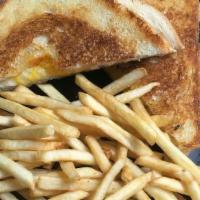 Grilled Cheezy · Sourdough toast w/melted cheddar cheese and fries.. **Allergens: wheat, cow's milk