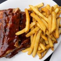 Baby Back Ribs · These are one of our house specialties; lean baby back ribs are slowly braised and finished ...
