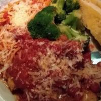 Chicken Parmesan · A colorado Red Bird Farms chicken breast sautéed and served on a bed of linguini and finishe...