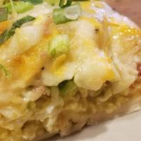 Eggs Guillermo · Scrambled eggs, tomatoes, fresh avocado and scallions baked inside a large flour tortilla an...