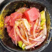 Poke Tuna · Raw. Tuna chunks, avocado, onion, green onion, chef special sauce, and sesame seed.