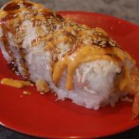 Tiger Roll · Tempura shrimp inside, crab salad on top, sesame seed, eel sauce, and spicy mayo.