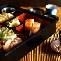 Tori Bento · Grilled chicken teriyaki, chicken gyoza, cucumber sunomono, California roll, fruit and miso ...