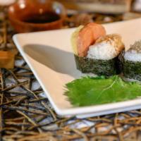 Spam Musubi · Rice ball topped with spam, tamago and teriyaki glaze, wrapped with a seaweed band.