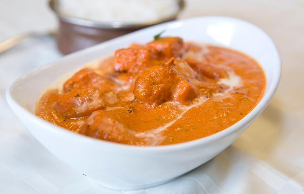 Chicken Tikka Masala · Top menu item. Boneless marinated chicken cooked in a thick curry sauce with fresh tomatoes, onions, bell peppers, and coriander leaves.
