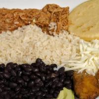 Pabellón Caraotas · Caraotas (frijoles negros), tajadas, (platano maduro frito), carne mechada and queso / black...