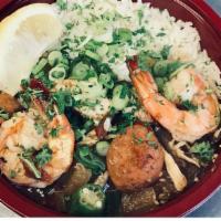 The Trinity · Our large gumbo sauce with chicken, andouille, Shrimp, and okra. My personal favorite combin...