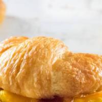 Croissant Sandwich · Scrambled eggs topped with your choice of ham, bacon, chorizo or sausage and your choice of ...