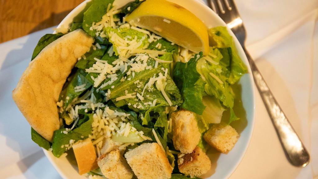 Grilled Chicken Caesar Salad · Another classic! Five oz. grilled breast of chicken, parmesan cheese and Caesar dressing, hand-tossed with crisp romaine lettuce served with wedge of lemon.