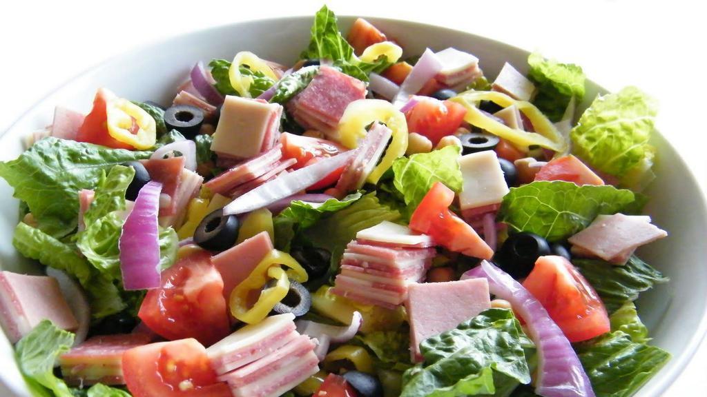  Zuesanti-Pasta Salad · Black forest ham, Genoa salami, provolone cheese, cherry tomato, cucumber, shredded carrot, pepperoncini, red onion, black olives and croutons served on a bed of crisp romaine lettuce with our golden it.